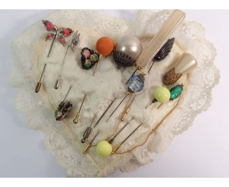 A silver and enamel butterfly hat pin (unmarked) and various vintage hat pins 