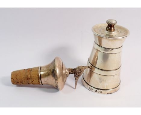 A silver pepper grinder London 1909 and a silver filled bottle stopper with pheasant finial Birmingham 1992 