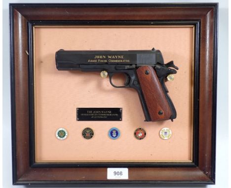A Franklin Mint John Wayne Armed Forces commemorative replica .45 Automatic, the replica with facsimile John Wayne Signature 
