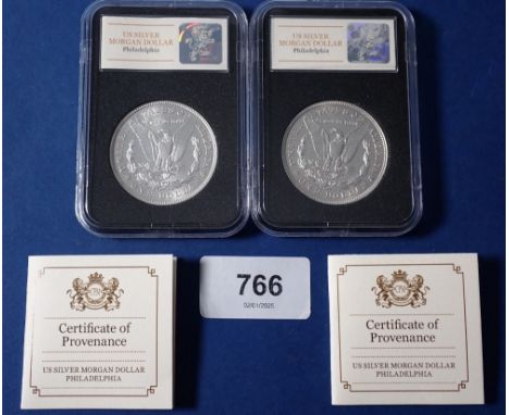 Two USA silver morgan dollars, each in case with certificate and each boxed, both 1921 Philadelphia