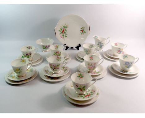A Royal Albert 'Flowers of the Month' vintage tea service comprising nine cups and saucers, nine tea plates, milk, sugar and 
