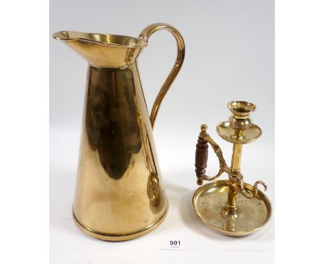 An Edwardian brass jug by JS &amp; SB, 28cm tall and a Victorian chamber stick with wooden handle