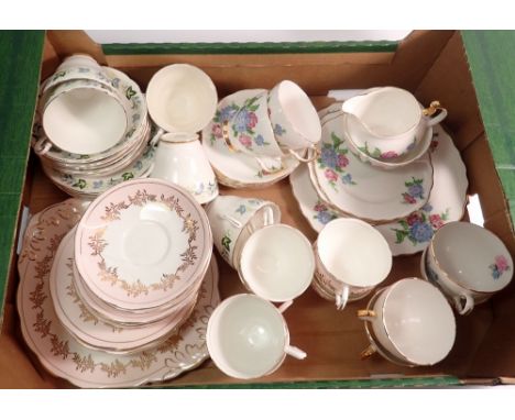 A Salisbury pink and gilt vintage tea service with six cups and saucers, tea plates and cake plate plus another part tea serv