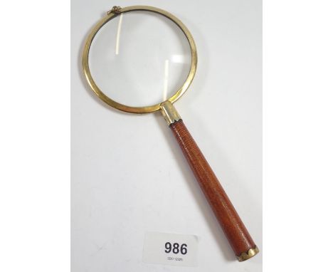 A vintage English made magnifying glass with leather handle by P H Vogel &amp; Co, 21cm long