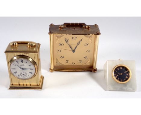 An 8 day Swiss Metrapol mantel clock, a Smiths Astral miniature carriage clock and an onyx small desk clock