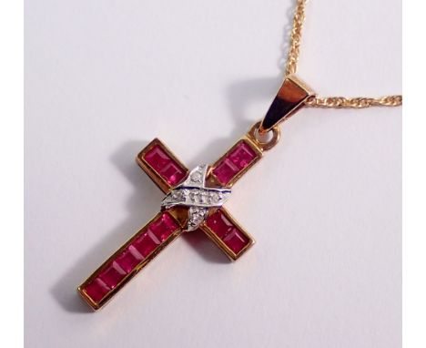 A 9 carat gold ruby crucifix and chain, 2 x 1.2cm, 2g
