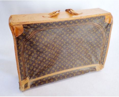 A Louis Vuitton early 20th century suitcase made in the USA, soft sides, label to interior - handle a/f, 55 x 72 x 24cm