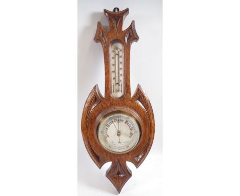 An oak framed barometer/thermometer, 44cm