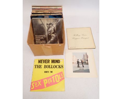 A box of Rock and Roll vinyl records including Sex Pistols, Pink Floyd, The Rolling Stones, The Kinks etc.