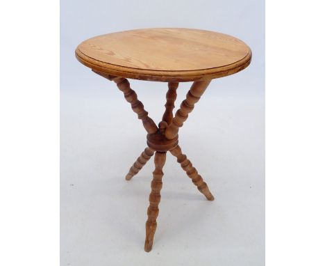 A Victorian pine occasional table on bobbin turned supports, 56cm diameter