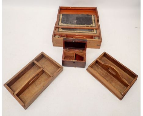A 19th century mahogany rectangular tea caddy and two stained wood cutlery trays and a writing slope a/f 