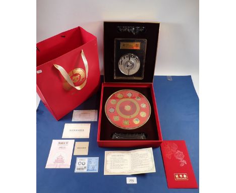 A Chinese coin gift pack containing a 2024 silver 10 yuan 'Panda' coin 30g with 2x 10g silver surrounds in a plastic display 