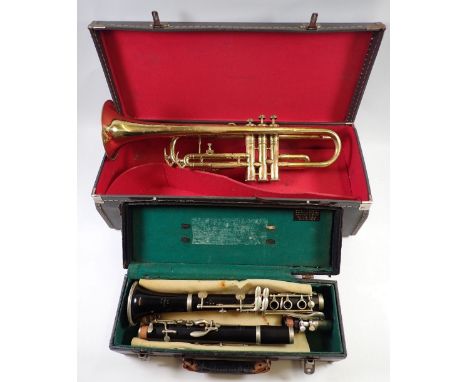 An old brass trumpet and a Malerne of Paris clarinet, both cased