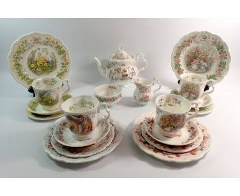 A Royal Doulton Bramley Hedge tea service for Spring, Summer, Winter and Autumn comprising tea pot, four cups and saucers, fo