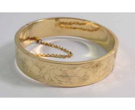 A 22 carat 'gold lined' hinged bangle 