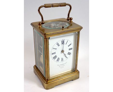 A 19th century French striking brass cased carriage clock retailed by West End Watch company, 13cm tall
