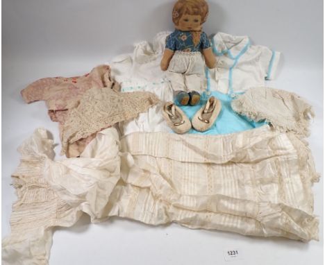 A Victorian lace christening gown and bonnet with two other more modern childrens outfits and a Deans Rag book doll etc. 
