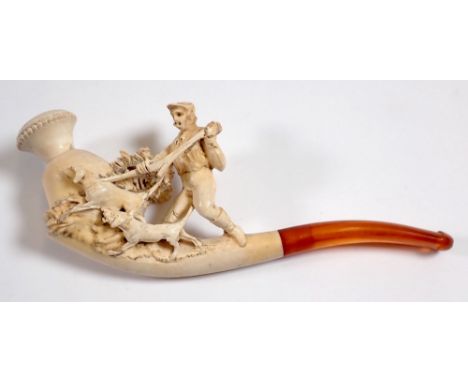 A 19th century meerschaum pipe carved in the form of a huntsman and hounds, 13cm