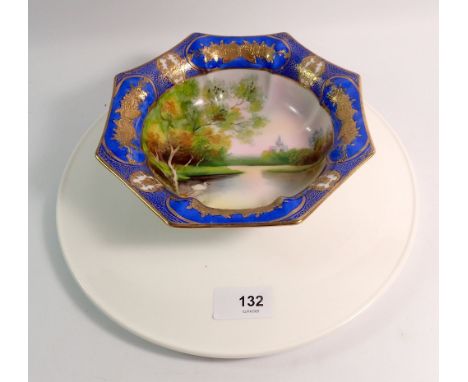 A Noritake octagonal dish painted swans and river scene, 18.5cm diameter and a Royal Worcester cake stand