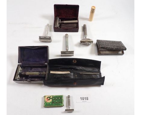 A collection of vintage razors including the 'Valet' Auto Strap safety razor, a miniature razor, 4cm etc.