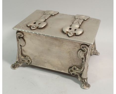 An Arts &amp; Crafts silver trinket box in the form of a chest with strap hinges and hoof feet, 11 x 8cm, London 1905, Connel
