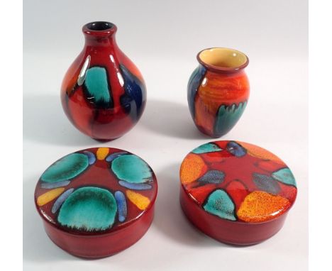 Two Poole Volcano vases and two trinket boxes, 11cm diameter