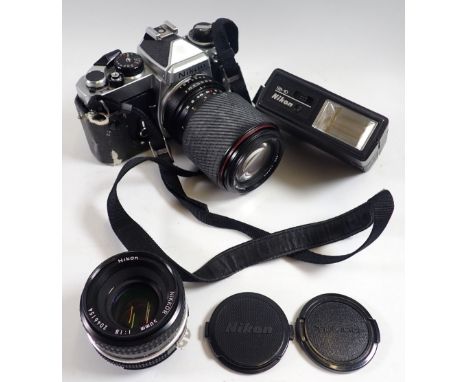 A Nikon FE camera with a Nikon 50mm lens and a Tokina SD 70-210mm lens etc. cased 