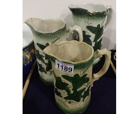 Three leaf patterned ceramic graduating jugs, largest H: 20 cm. Not available for in-house P&amp;P, contact Paul O'Hea at Mai