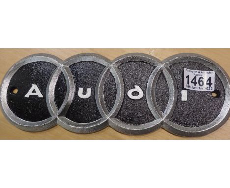 Cast iron Audi shop wall sign, L: 29 cm. P&amp;P Group 2 (£18+VAT for the first lot and £3+VAT for subsequent lots) 