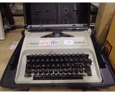 Olympia Carina 2 vintage cased typewriter. Not available for in-house P&amp;P, contact Paul O'Hea at Mailboxes on 01925 65913