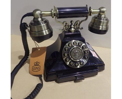 The Duke is a push button telephone with a black &amp; brass finish and traditional cloth handset curly cord. Compatible with