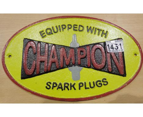 Cast iron Champion spark plugs shop wall sign, L: 28 cm. P&amp;P Group 2 (£18+VAT for the first lot and £3+VAT for subsequent