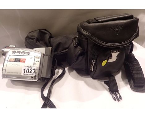 Cased Canon video camera with tripod. P&amp;P Group 3 (£25+VAT for the first lot and £5+VAT for subsequent lots) 