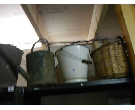 A vintage watering can, bucket etc.,