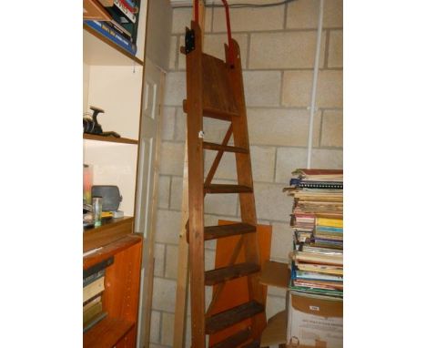A set of wooden step ladders.