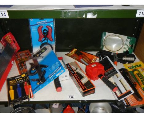 A mixed lot of tools, some new.