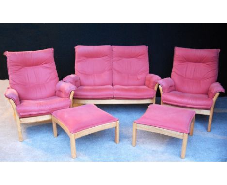 Ercol suite comprising a two-seater sofa, pair of armchairs and two footstools.&nbsp; &nbsp;(5) 