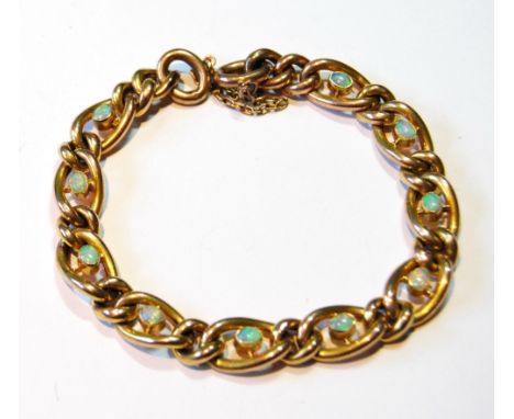 Gold bracelet of curb pattern with oval opal collets, '9c', 13g.&nbsp; &nbsp;CONDITION REPORT:&nbsp;No snap or padlock.&nbsp;