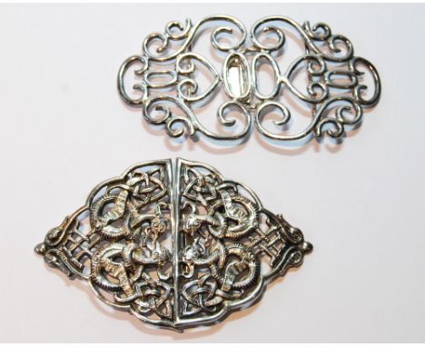 Silver belt buckle of pierced openwork celtic style and another, Birmingham 1900/1. 