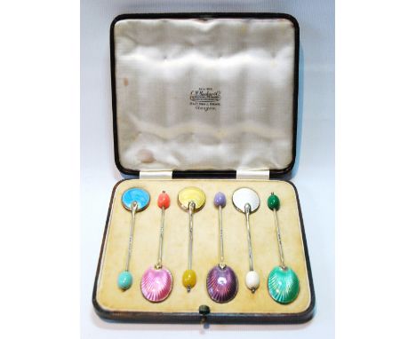 Set of six silver and polychrome enamel coffee spoons, 1938, cased. 