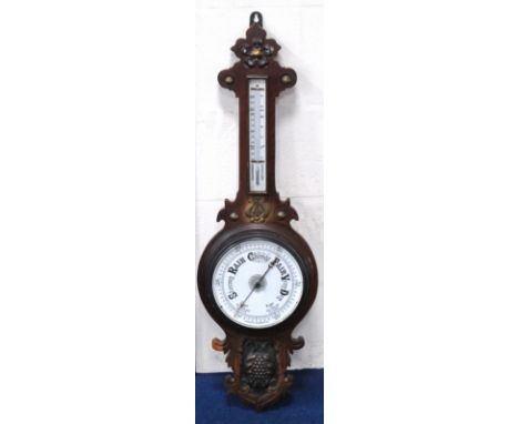 Oak framed aneroid barometer mounted by a thermometer, 91cm high. 