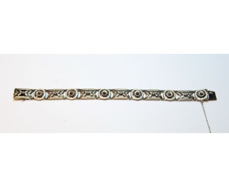 Early 20th century white gold bracelet of six openwork panels and circular panels with tiny enamelled ladybirds, probably 9ct