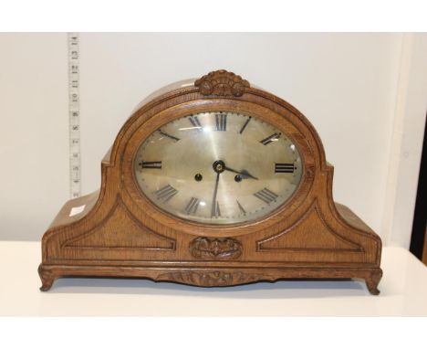 A oak cased mantle clock Postage unavailable 
