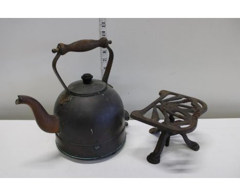 vintage copper kettle and cast iron trivet 