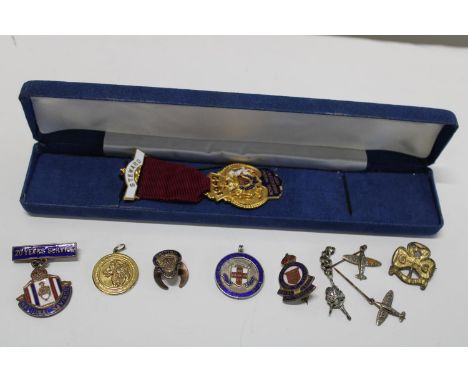 A selection of assorted enamel badges and medals including silver examples 