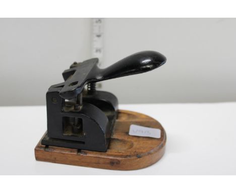 A vintage metal hole punch 