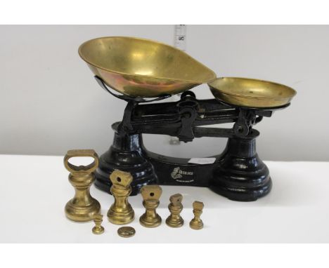 A set of vintage kitchen scales with brass weights Postage unavailable 