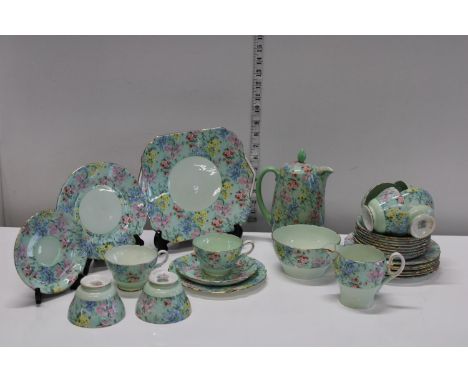 A Shelley 'Melody' pattern tea service. Damage to milk jug, finial on teapot and hairline crack to two cups. One plate has a 