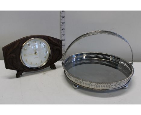 A silver plated handled basket and a vintage west lox mantel clock 