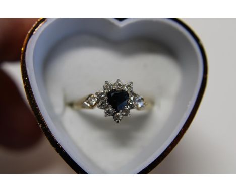 A 9ct heart shaped Sapphire cluster ring Size R 